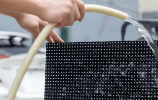 Water spray test on outdoor LED module for waterproofing, weatherproofing and IP rating verification